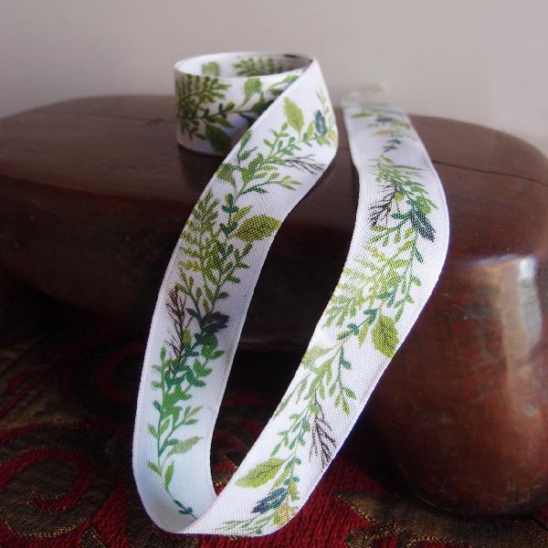 1" White ribbon with green leaves. - Size: 1" x 10.9 yards
